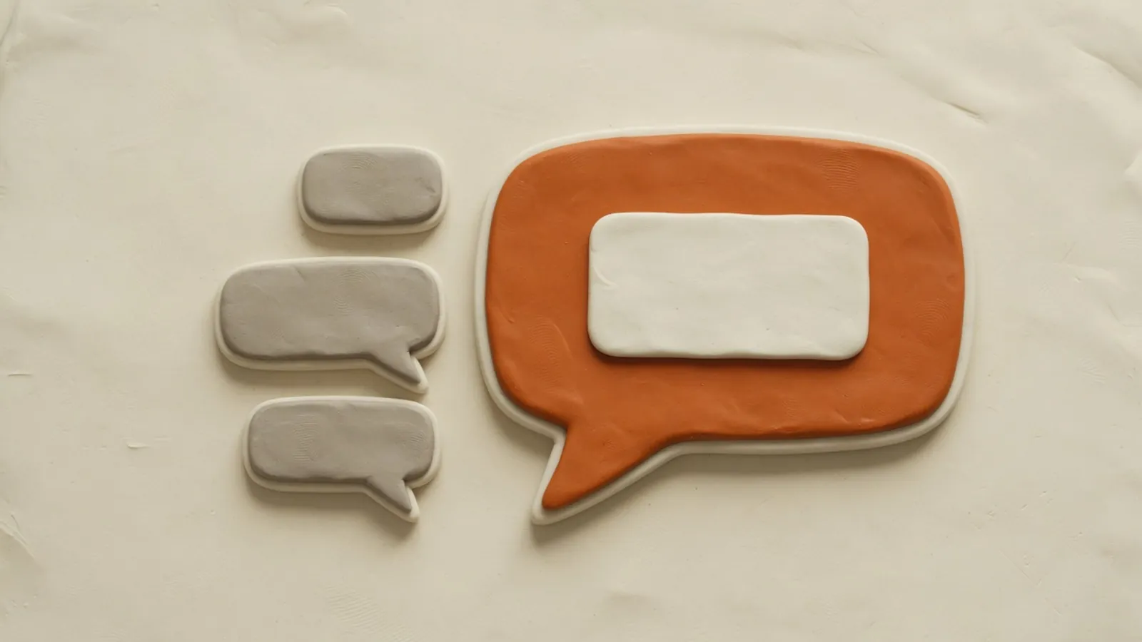 A large assistant chat bubble replies inside a generic team-chat window next to smaller message bubbles.
